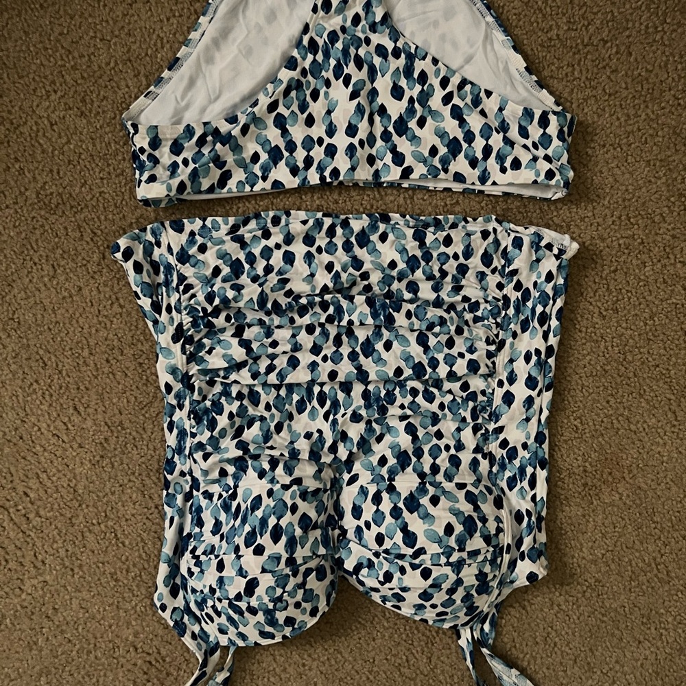 White and blue built in bra tankini. Worn once. Size 10. Boutique bought.